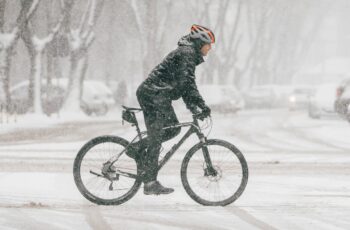 Man cycling in the snow